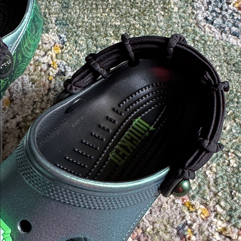 CROCS WICKED Classic Clogs with green metallic upper and themed Jibbitz charms. - Picture 2 of 8